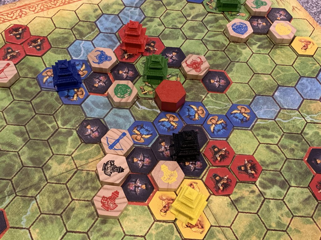 Board Game pieces on a hexagonal grid.