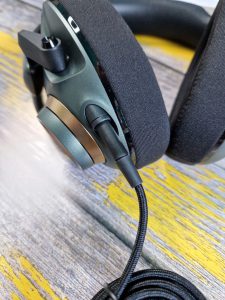 A close-up of the H6PRO headphones, showing where the audio cable connects.